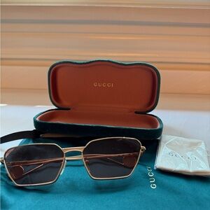 Gucci Women's Black and Gold Sunglasses